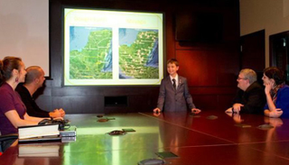 William Gadoury, 15, explains his theory of the existence of an unknown Maya city before scientists at the Canadian Space Agency. (Image: Canadian Space Agency)
